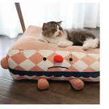 Clown Pet Sleeps In A Cozy Pet Bed - Heritage cosmetics and beauty care