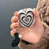 Black Stacked Heart Earphone Case Heritage cosmetics and beauty care